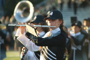 Reese Sheldon (26) playing the flute during the halftime show.