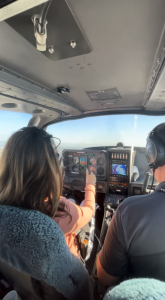 Olivia Sovik (25) flying a plane with her pilot license.