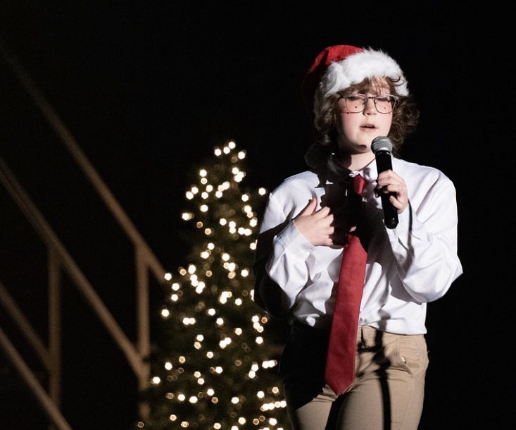 Thespian sings onstage at the 2022 Winter Showcase.