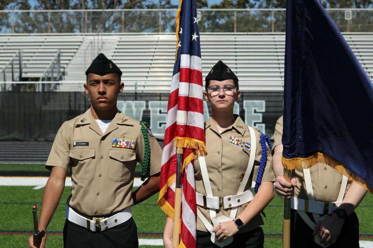 Our color guard Adelaine Plymale and (blank) stand in formation during the inspection.