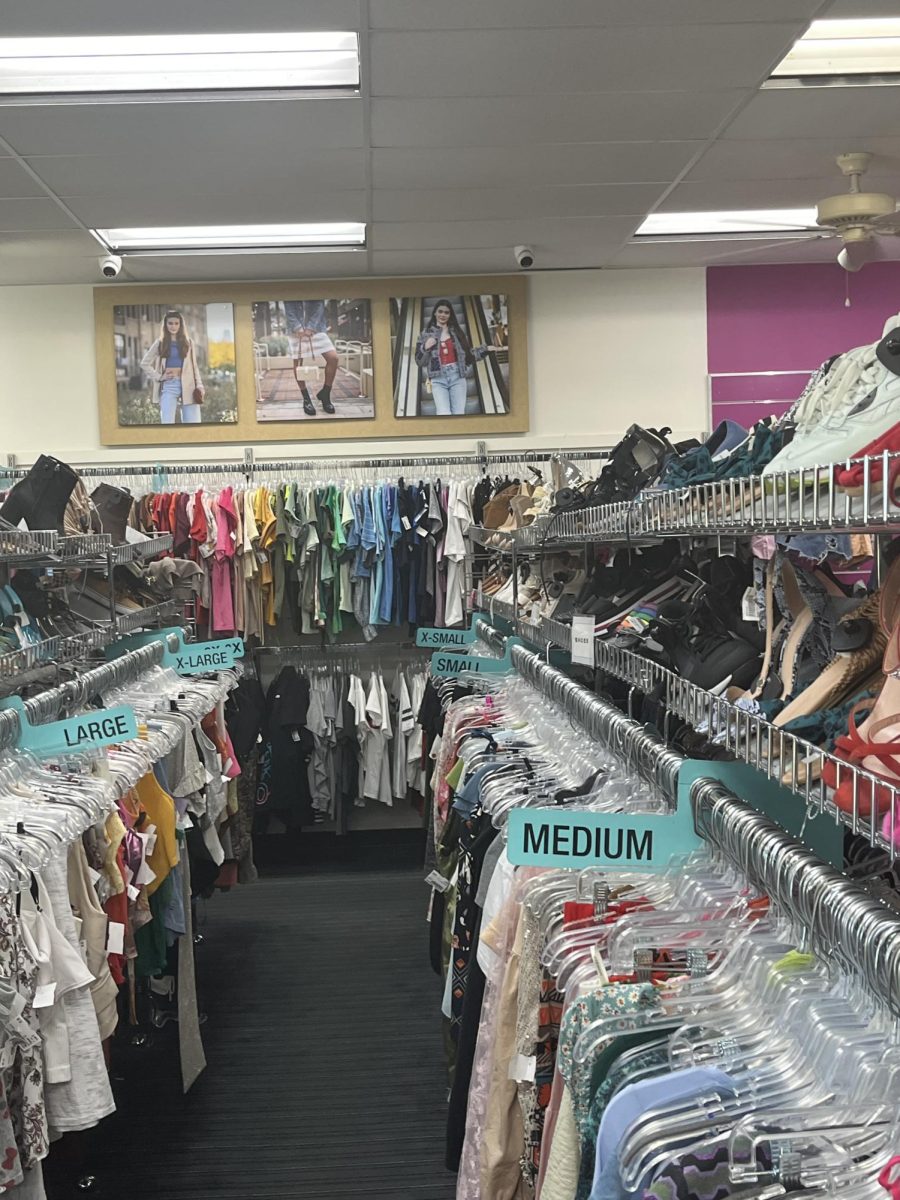 An aisle inside of Platos Closet located in Britton Plaza.