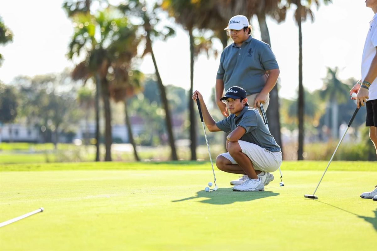 Team Golfers Colton Fair ('25) and James Arong ('27) trading strokes during match. 