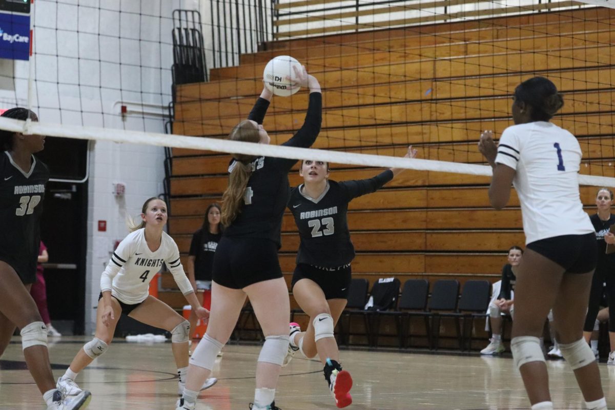 Torrey Page ('26) setting the ball to player #23 Enya Cooke ('27).