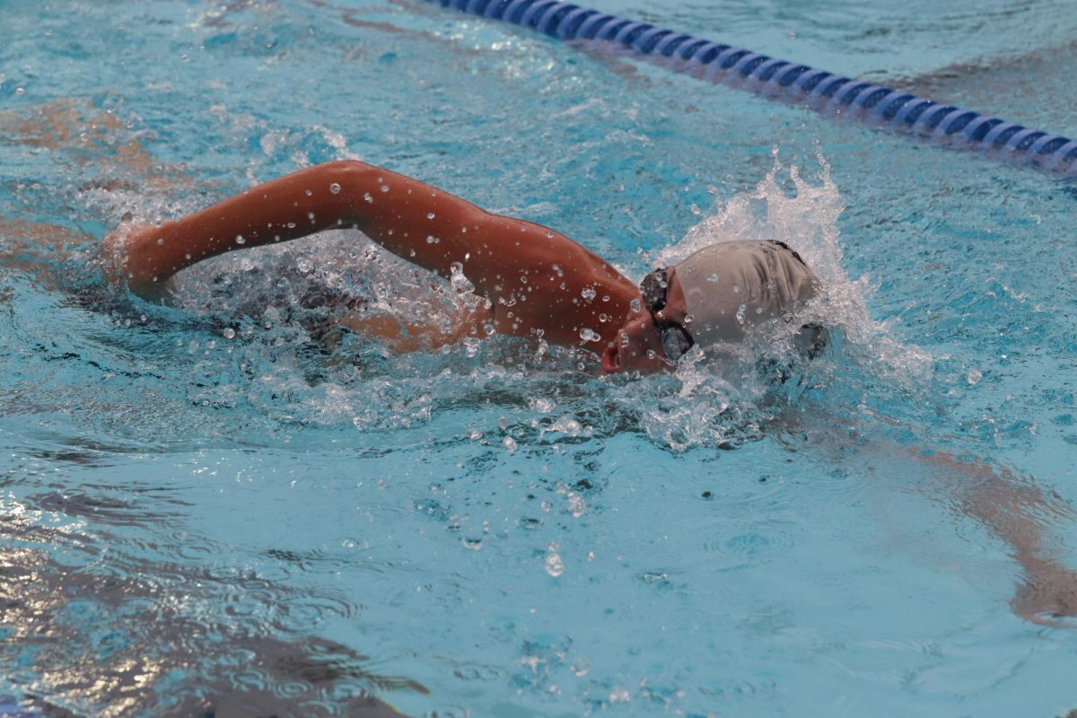 Mason Lucious ('27) catches breath while swimming. 