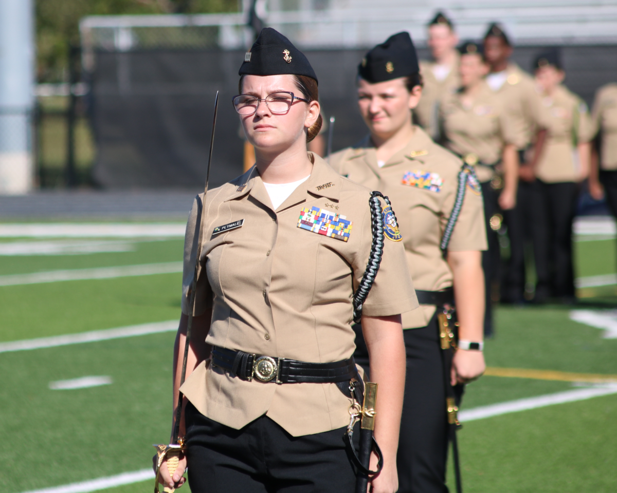 NJROTC Commander Adeline Plymale gets into position for the Area Manager Inspection.