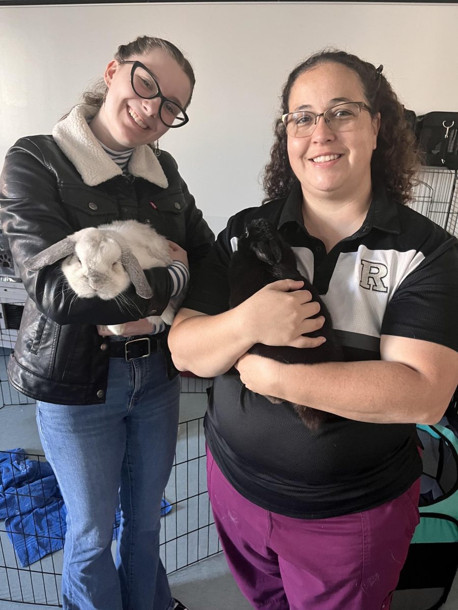 The author and Ms. Perez with Pretty Girl Poe(black) and Snowball(white lop-ear)