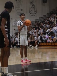 Senior shooter Zyon Floyd (26') setting up for a free throw
