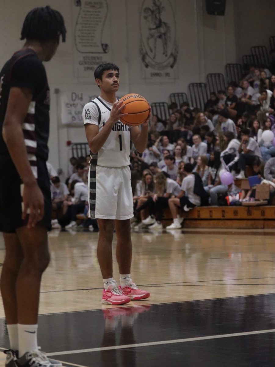 Senior shooter Zyon Floyd (26') setting up for a free throw