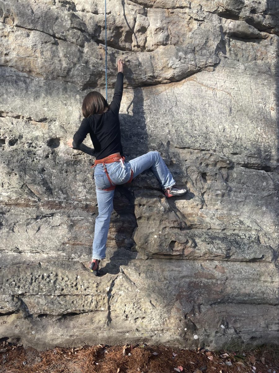 Sadie Scheu ('26) participates in outdoor rock climbing.