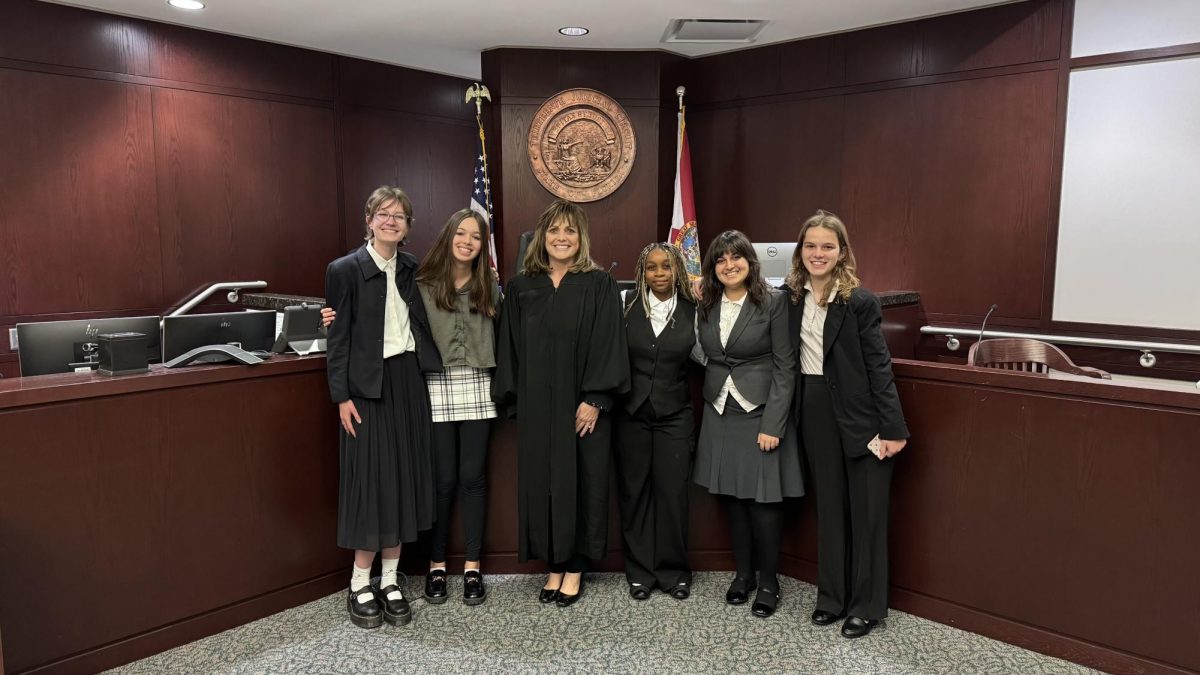 Mock Trial team standing in the Courtroom. 