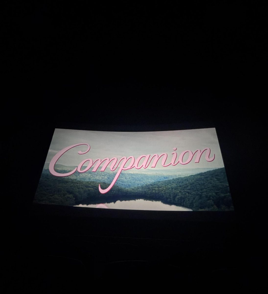 Photo taken from movie theater of the retro-styled title shot for the movie "Companion."