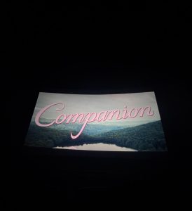 Photo taken from movie theater of the retro-styled title shot for the movie "Companion."