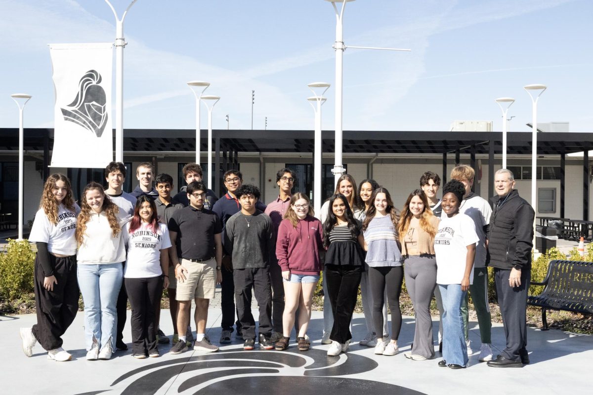 The top 10 students from both IB and Traditional tracks  pose with Principal David Brown.