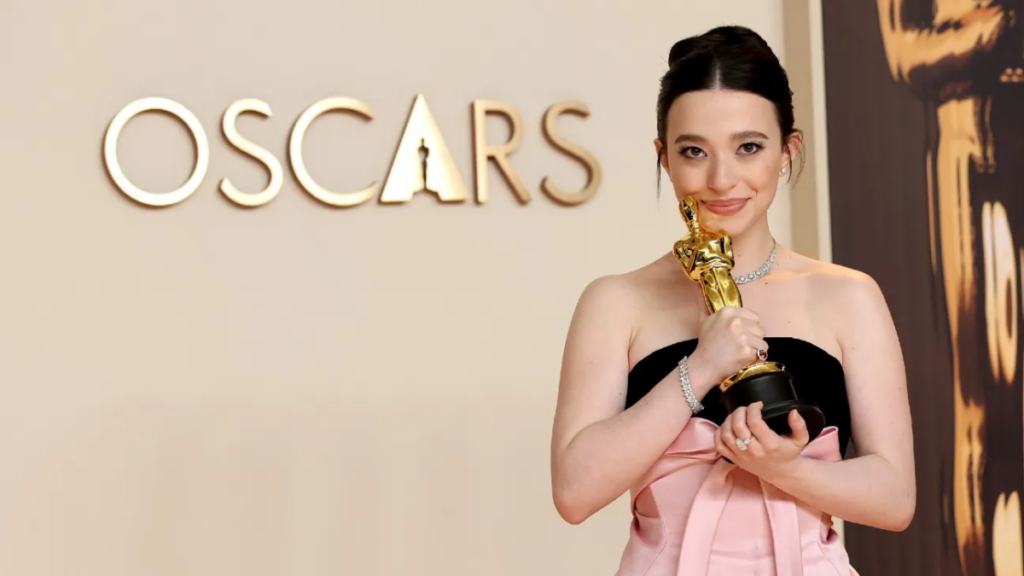 Mikey Madison celebrates her Best Leading Actress win at the Oscars.