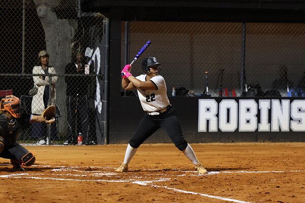 Jasmine Welch ('27) steadies in her batting position before the pitcher throws the softball. 