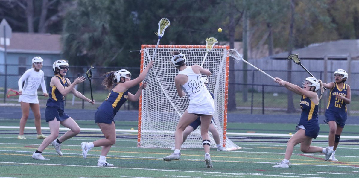 Mae Albritton ('25) launches the ball at Steinbrenner's goal amidst blocking defenders. "We pushed through and showed a great effort," Albritton said.