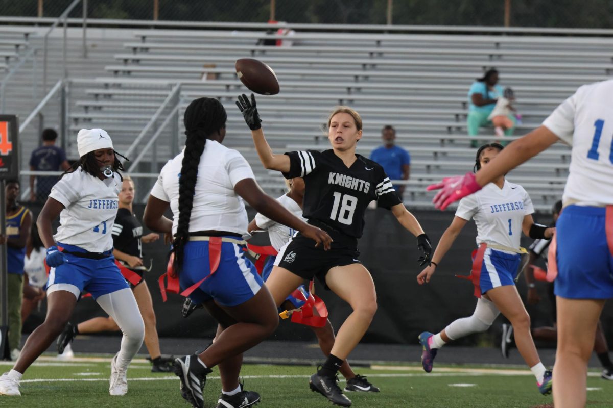 Bella Villanti ('26) doing a lateral pass as she runs into traffic
