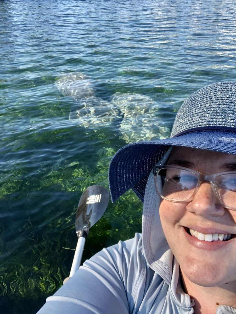 The new chemistry teacher, Ms. Lau kayaking with manatees.
