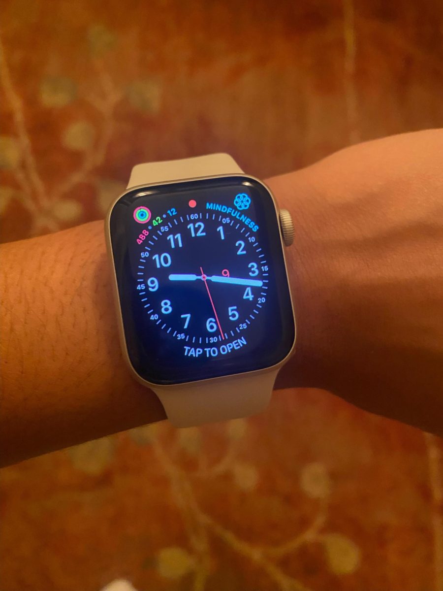 Time becomes the focus as a person looks down at their watch.