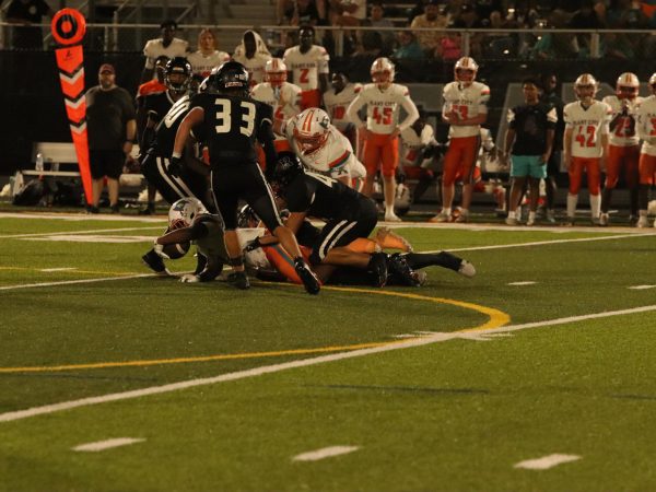 Robinson Players tackle a plant city player.