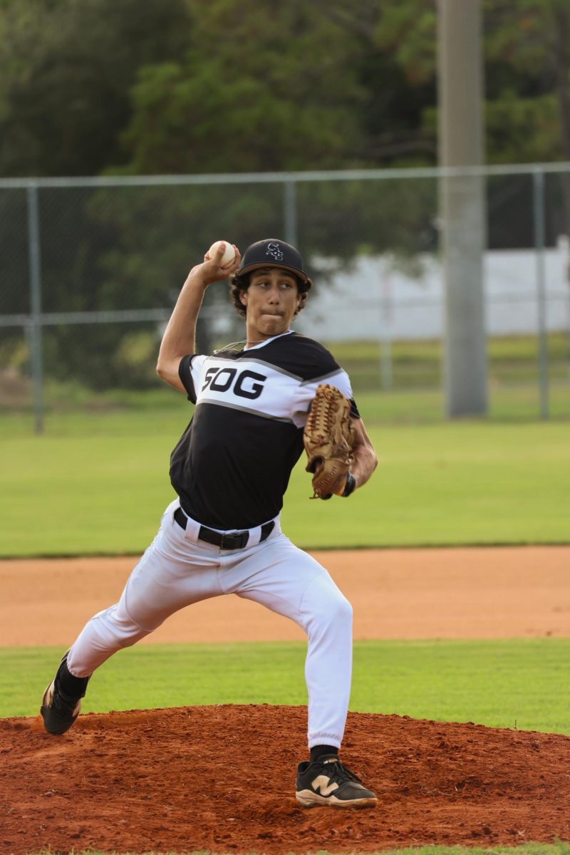 Gavin Montera ('26) makes a pitch on the mound.