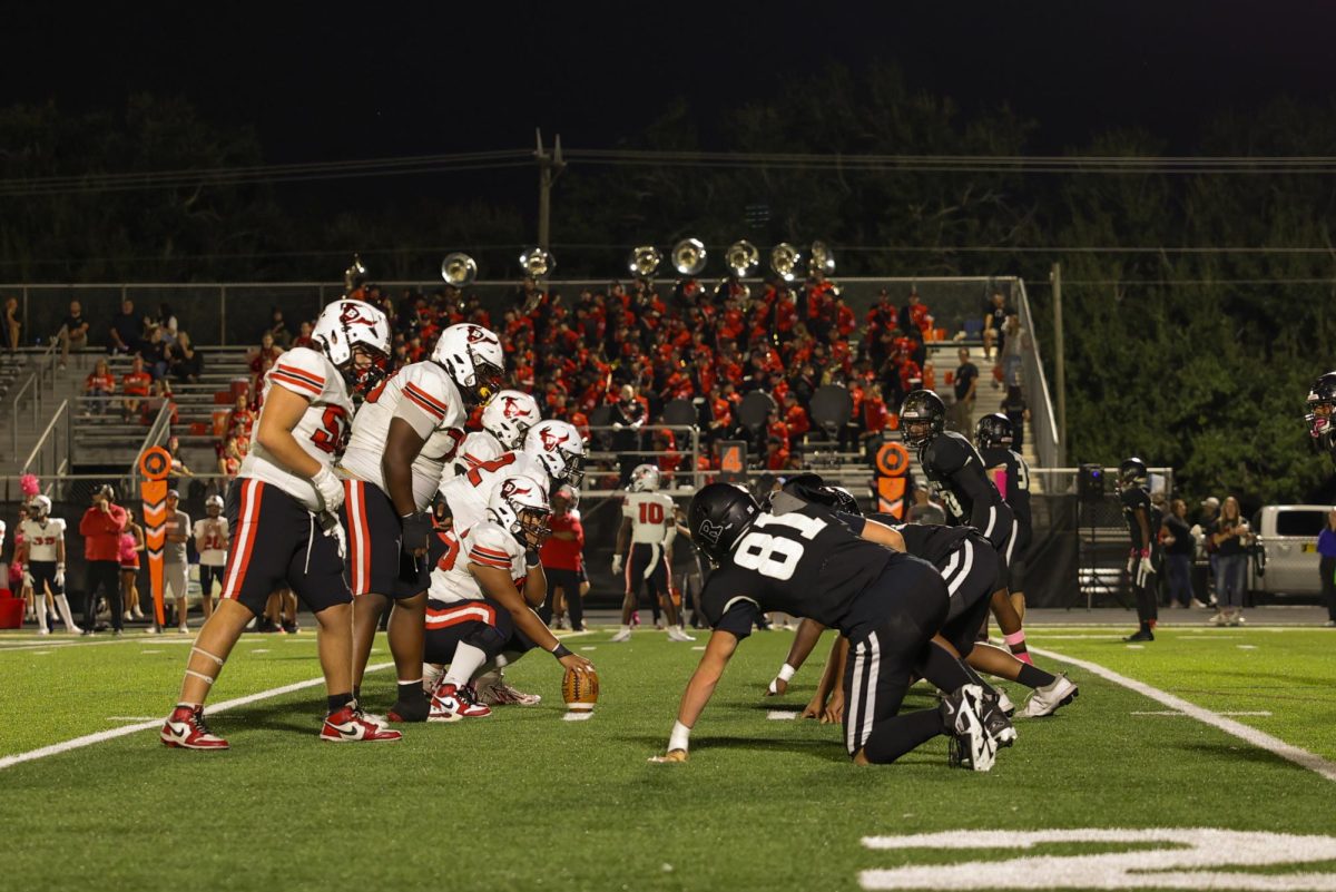 The players get ready for the first play of the game.