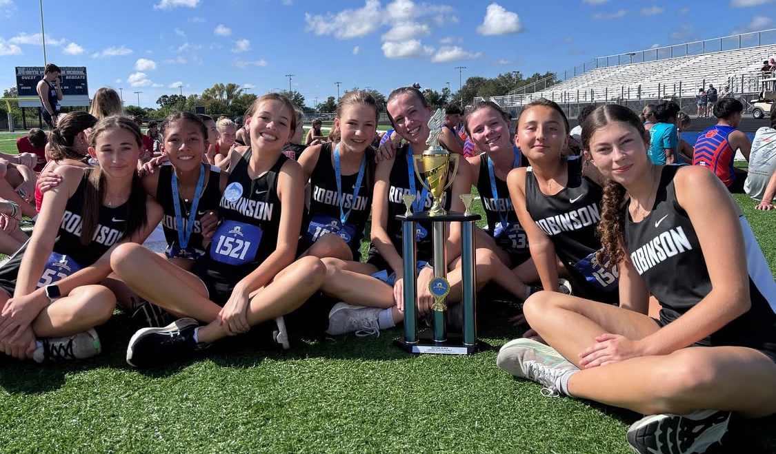 Girls XC team poses with their trophy after winning 2nd overall at the Northport meet.