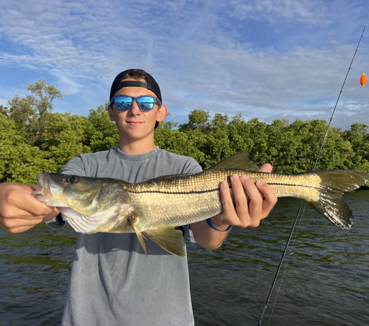 Mason Lucius ('27) holding a snook
