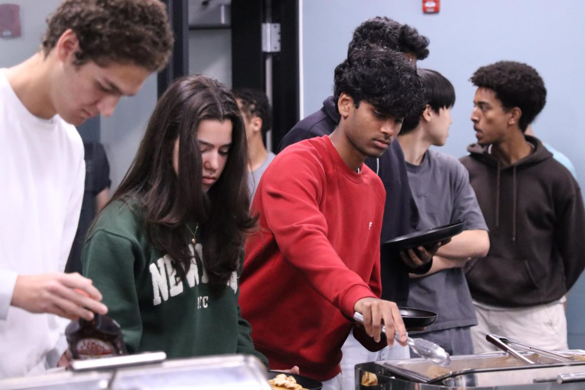 Senior line up to serve themselves Tavern's celebratory breakfast.