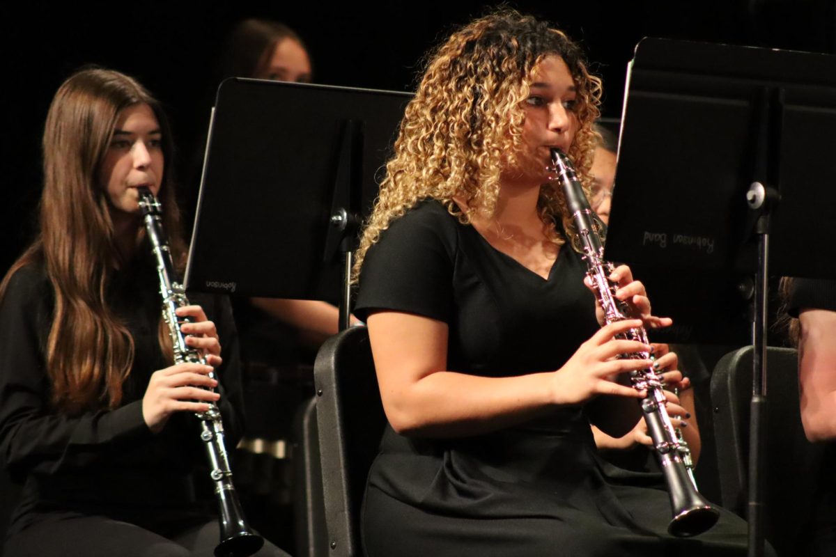 Clarinet players performing as a part of the Robinson Wind Ensemble.