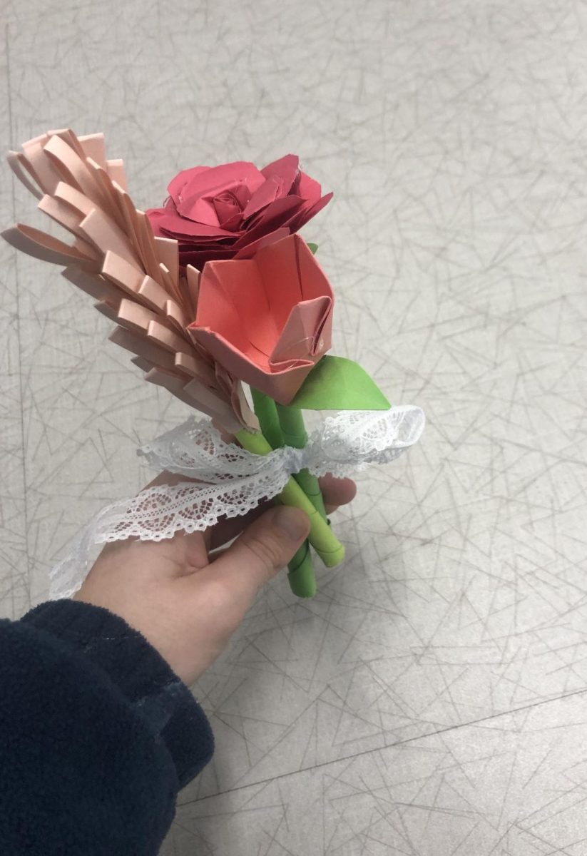 A paper bouquet consisting of roses, tulips and lilacs. Tied with a bow, they make a thoughtful gift and a pretty decoration!
