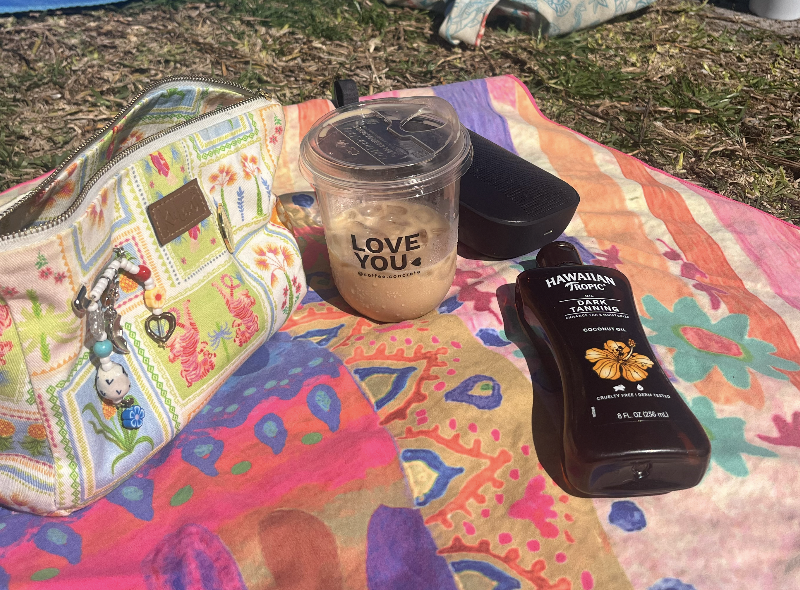 Coffee from "Coffee Concrete" and tanning setup at North Shore Park.