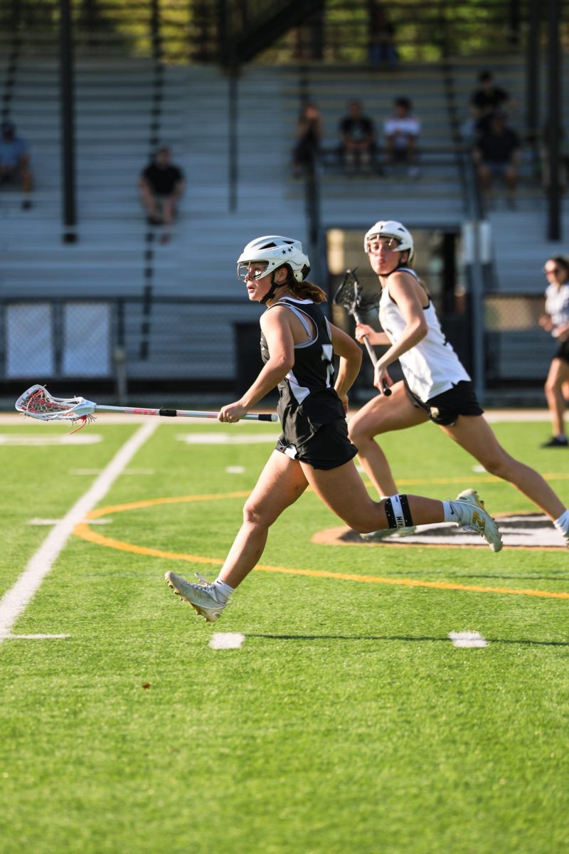 Elina Sizemore ('27) sprints down the field to help defend the goal.
