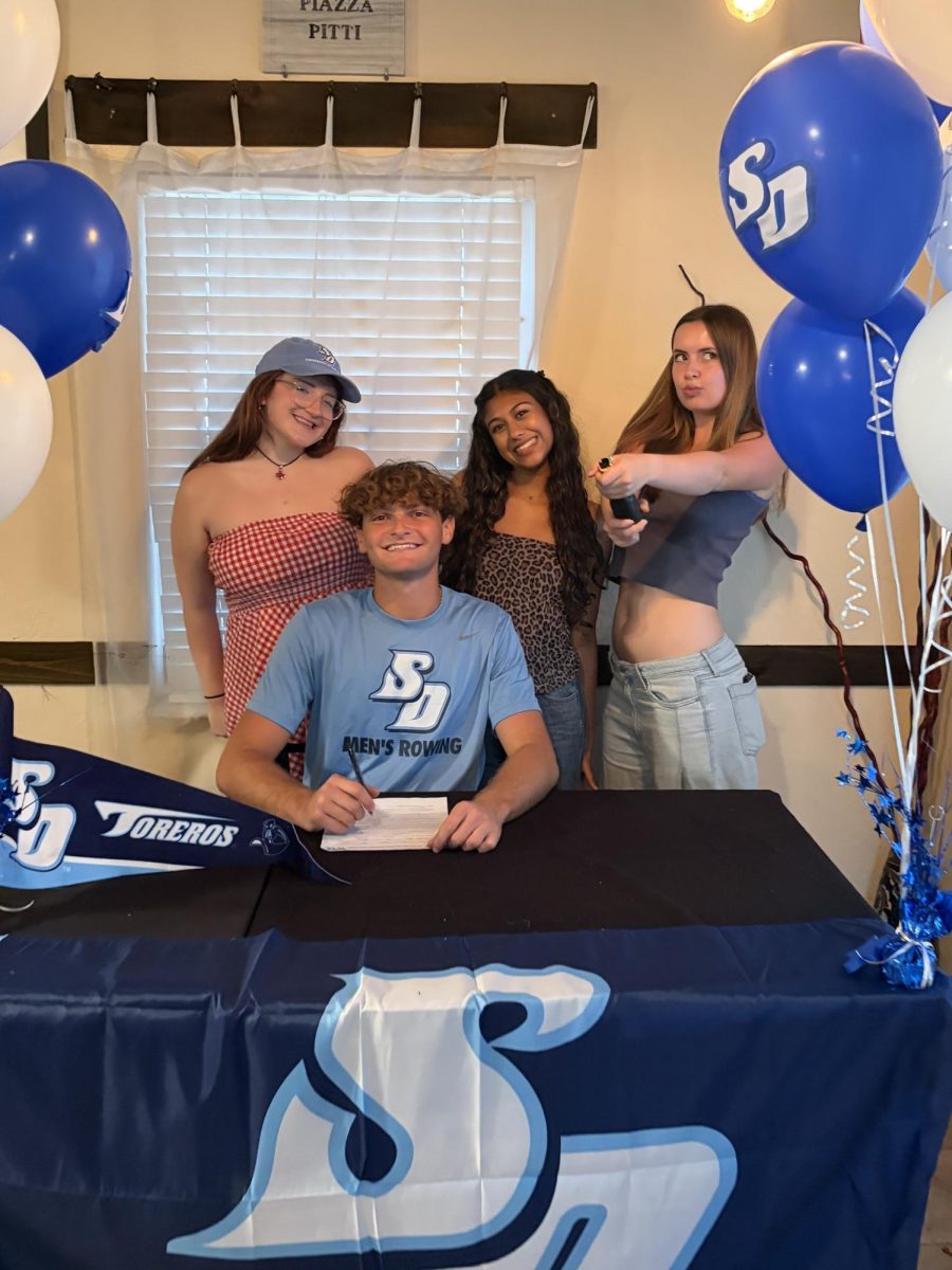 Robinson's 2025-2026 editing staff at Adriano Casamento's signing day.
