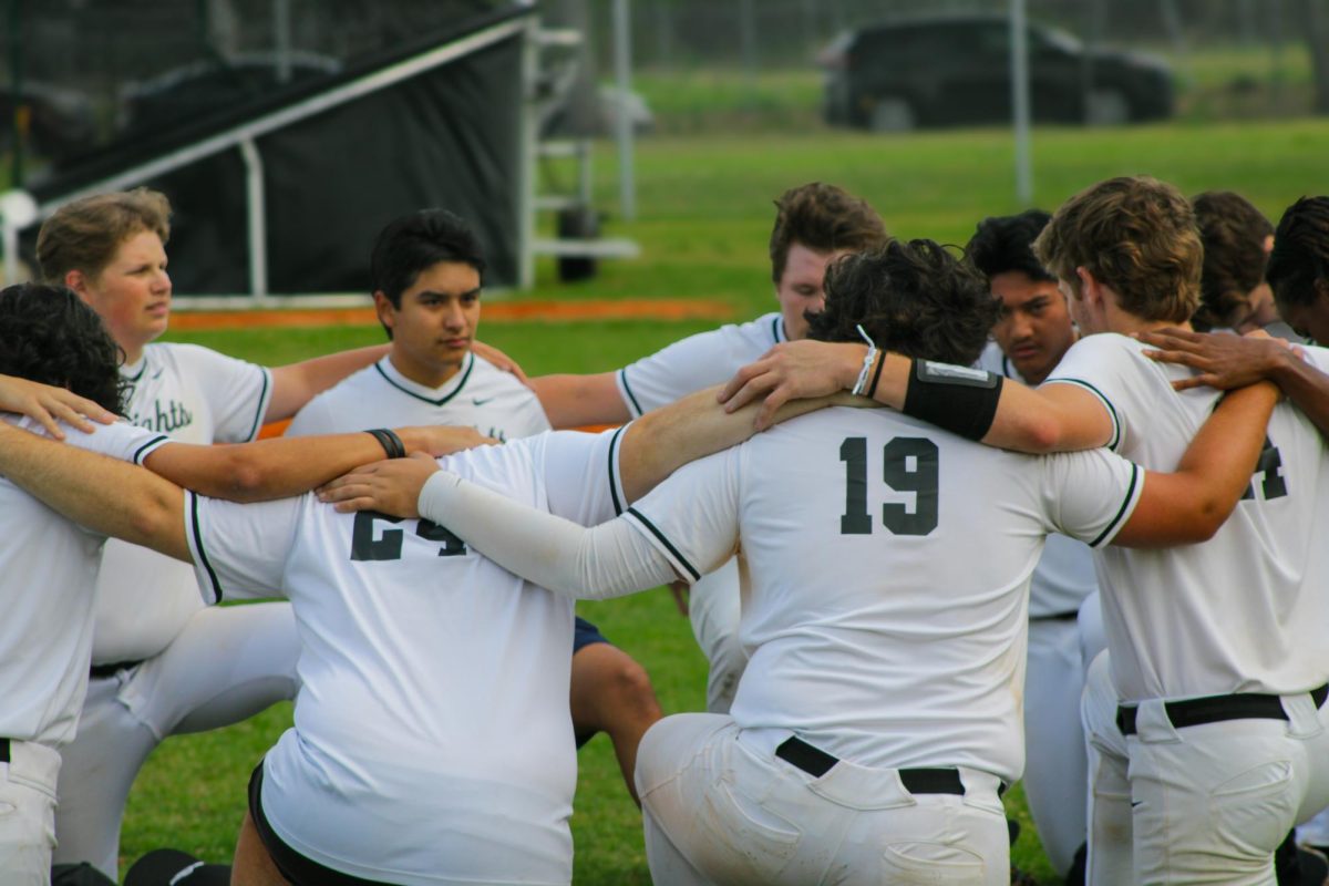 Team huddle before their last game of the season.